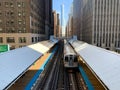 Elevated `el` train arriving at the Adams/Wabash station in Chicago south loop during spring morning Royalty Free Stock Photo