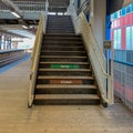 Elevated `el` train station/platform and stairs leading to overpass at Clark/Lake stop f