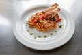 Elevated Elegance: Spaghetti with Tomato Sauce and Sliced Roast Chicken Breast on a White Plate Royalty Free Stock Photo