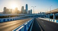 Elevated Highway Interchange with City Skyline at Sunrise or Sunset overpass road Royalty Free Stock Photo