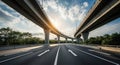 Elevated Highway Overpass with Arrow Markings and Trees Under a Cloudy Sky elevated road traffic Royalty Free Stock Photo