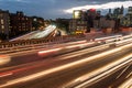 Elevated junction high way asphalt roads with night car traffic lights in the city.