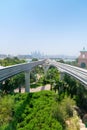 Elevated, Monorail Train Tracks Stretching towards a Metropolita