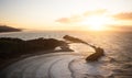 Panorama view of seaside Castle Point Lighthouse on steep cliff hill, Tasman Sea Pacific Ocean Wellington New Zealand Royalty Free Stock Photo