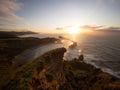 Panorama view of seaside Castle Point Lighthouse on steep cliff hill, Tasman Sea Pacific Ocean Wellington New Zealand Royalty Free Stock Photo