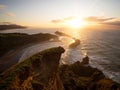 Panorama view of seaside Castle Point Lighthouse on steep cliff hill, Tasman Sea Pacific Ocean Wellington New Zealand Royalty Free Stock Photo