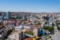 An elevated panoramic cityscape of Pristina, capital city of Kosovo, with numerous landmarks