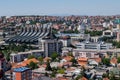 An elevated panoramic cityscape of Pristina, capital city of Kosovo, with numerous landmarks