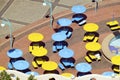 Elevated perspective of brightly colored yellow and blue umbrellas along Indian Ocean front of Durban, South Africa Royalty Free Stock Photo