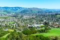 Elevated scenic view of San Luis Obispo urban area sprawl and green mountains of Santa Lucia Range from Bishop Peak Trail on sunny Royalty Free Stock Photo