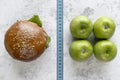 elevated view burger apple compare with measurement tape. High quality photo