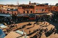 Elevated view of a bustling square and shops