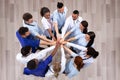 Elevated View Of Doctors Stacking Hands