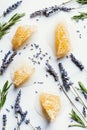 elevated view of honeycombs lavender and rosemary on white