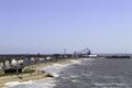 Elevated view of the incoming tide with blackpool pleasure beach in the distance