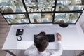 Security Guard Monitoring Multiple Camera Footage On Computer