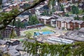 Elevated view of public space with palyground an alpine resort. Royalty Free Stock Photo