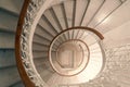 Elevated view of a spiral winding staircase with white railings