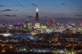 Elevated view to the illuminated, urban skyline of London