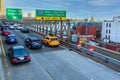 Elevated view of traffic on Brooklyn Bridge. Brooklyn Queens Expressway traffic sign. - New York, USA - 2021 Royalty Free Stock Photo