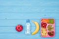 elevated view of tray with kids lunch for school, bottle of water and fruits Royalty Free Stock Photo