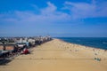 Elevated view of wide strip of sand along the boardwalk and ocean