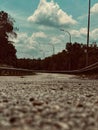 Elevated view of a winding, tree-lined road with no cars in sight Royalty Free Stock Photo