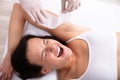 Woman Going Through Armpit Hair Removal Procedure Royalty Free Stock Photo