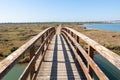 Elevated wooden boardwalk above the marshes of the Rio Piedras in El Rompido village, Huelva, Andalusia, Spain