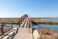 Elevated wooden boardwalk above the marshes of the Rio Piedras in El Rompido village, Huelva, Andalusia, Spain