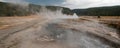 Elevated wooden boardwalk going past Black Warrior Hot Springs and Tangled Creek into Hot Lake in Yellowstone National Park