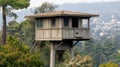 Elevated Wooden Guard Post Overlooking City, Surrounded by Trees and Greenery Royalty Free Stock Photo