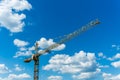 Elevating construction crane against the background of the cloudy sky. Royalty Free Stock Photo