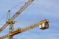 The elevating crane against the dark blue sky. Royalty Free Stock Photo