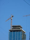 Elevating cranes. Building. Royalty Free Stock Photo