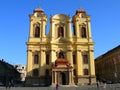 Elevation of bright yellow church against blue sky Royalty Free Stock Photo