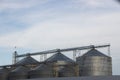 Elevator, huge container of the granary against the background of the blue sky