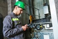 Lift machinist repairing elevator in lift shaft Royalty Free Stock Photo