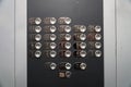 Elevator lift buttons keypad. Push car operating panel, COP panel pressing. Calling the lift inside the cabin Royalty Free Stock Photo