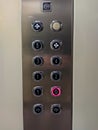 Elevator lift numbers interior for transportation inside a facility or a hotel with one number with red light selected