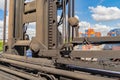 Elevator lift rail or reel metal equipment. Container lifting spreader device rail crane equipment, port warehouse trade Royalty Free Stock Photo