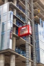 Elevator lifts workers up to the construction site