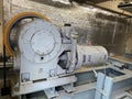 The elevator motor is in the control room. The motor has been used for a long time Royalty Free Stock Photo