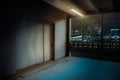 Elevator at parking garage at night outside with lamp shine at closed doors in future and horror look Royalty Free Stock Photo