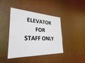 Elevator for staff only sign
