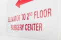 Elevator to 2nd floor surgery center sign