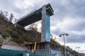 Elevator for tourists from the sea coast. Construction of the elevator on the street. An unfinished street elevator