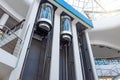 Elevators with counterbalanced concrete blocks, construction of an elevator mechanism in a shopping center Royalty Free Stock Photo