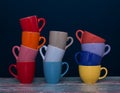 Eleven cups of coffee of different colors in three groups.