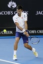 Eleven times Grand Slam champion Novak Djokovic of Serbia in action during his round 4 match at Australian Open 2016 Royalty Free Stock Photo